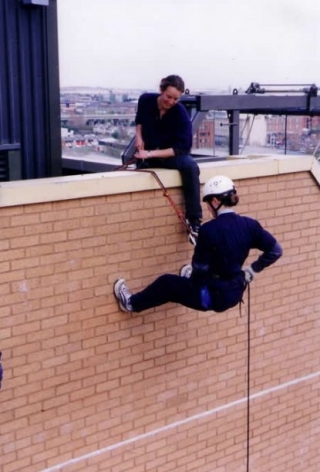 Abseiling from the top of a building